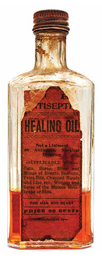 old, weathered bottle of 'healing oil'